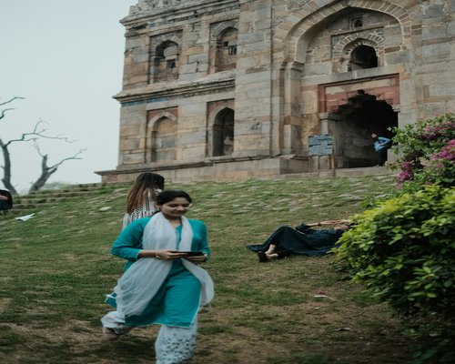 Person walking in an urban park in India